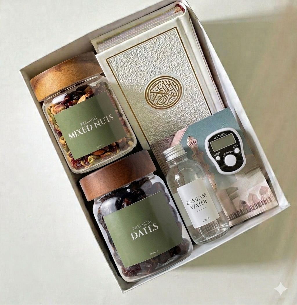 Gift set with jars of mixed nuts and dates, a bottle of Zamzam water, and a digital clock.