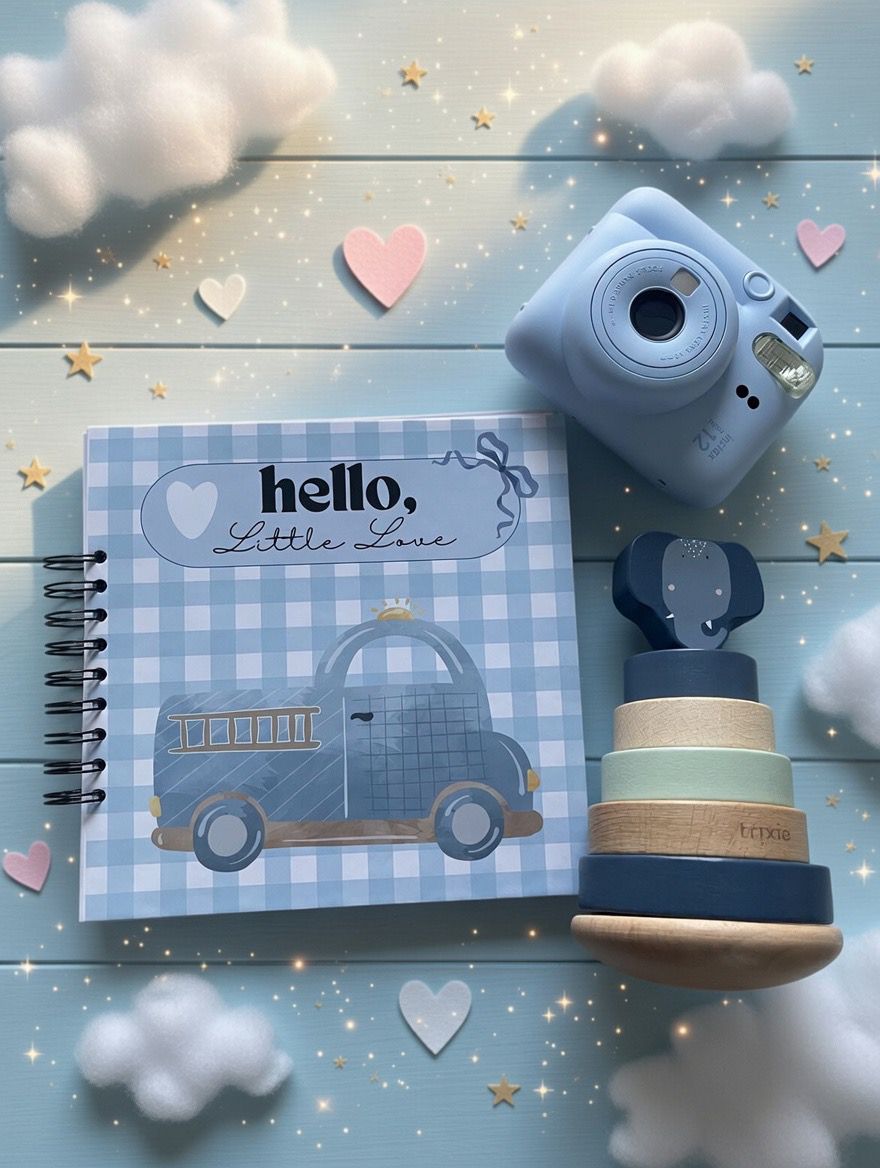 Levara baby book with blue checkered cover featuring a vintage car next to blue instant camera and wooden stacking toy