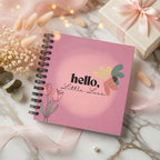 Levara baby book with pink cover reading hello little love decorated with flowers and leaves