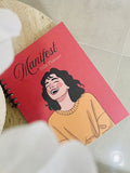 Levara Manifest 2026 productivity planner with illustrated woman on pink cover and spiral binding